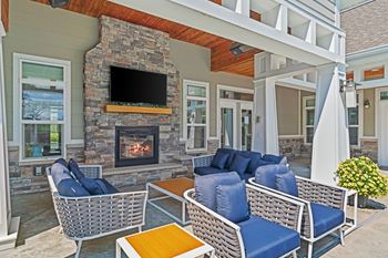 Outdoor lounge with overhead heaters & fireplace
